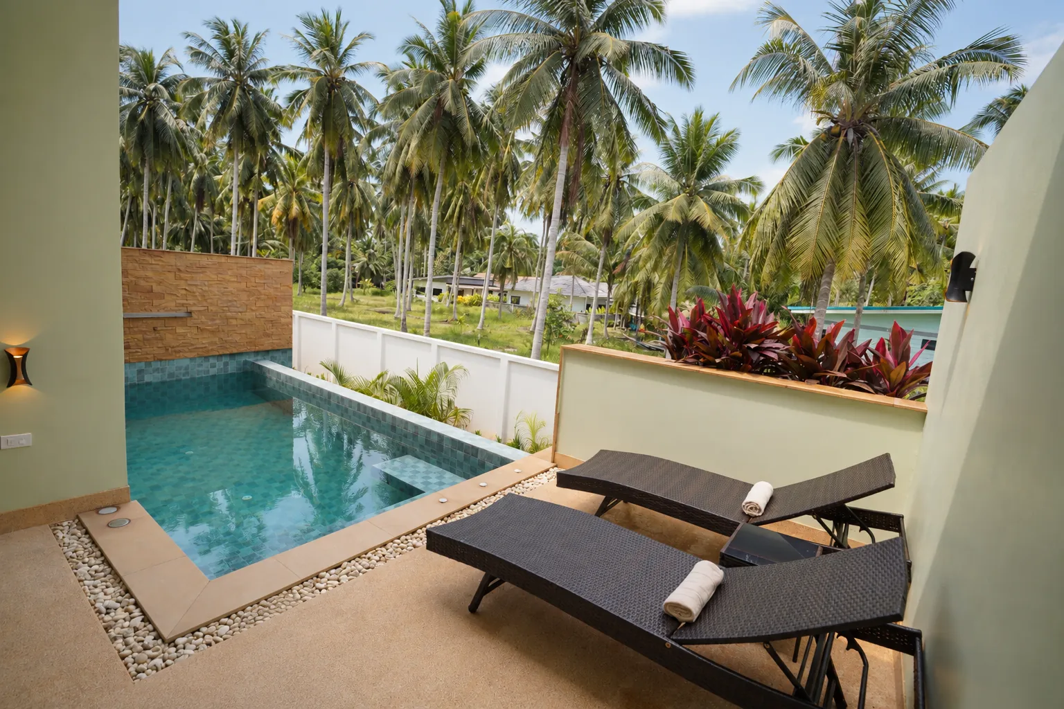 Tropical villa with pool and palms